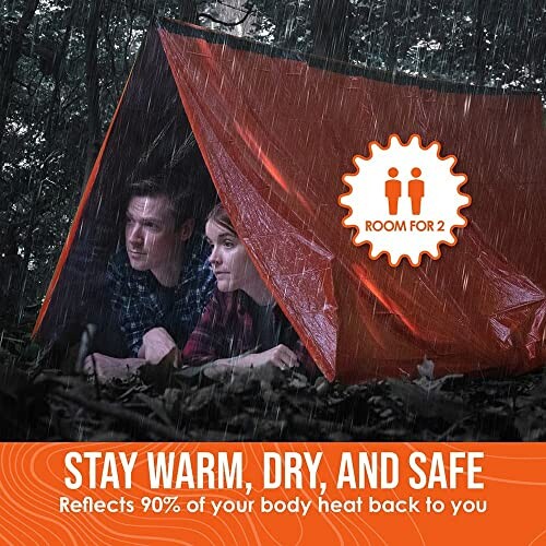 Two people in an orange emergency tent in the rain.