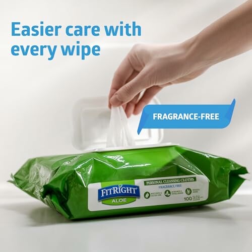 Hand pulling a wipe from a pack of FitRight Aloe fragrance-free personal cleansing cloths.