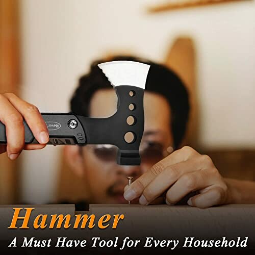 Person using a hammer to nail into wood.