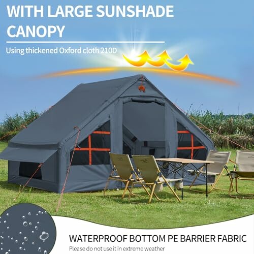 Large sunshade canopy tent with chairs and table on grass.