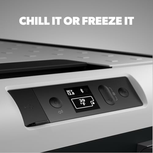 Close-up of a portable fridge freezer control panel with temperature display.