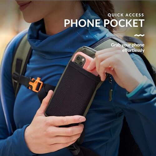 Person using a backpack phone pocket for easy access.