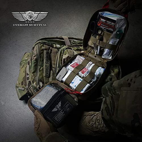 Tactical backpack with opened survival kit, showing medical supplies and tools.