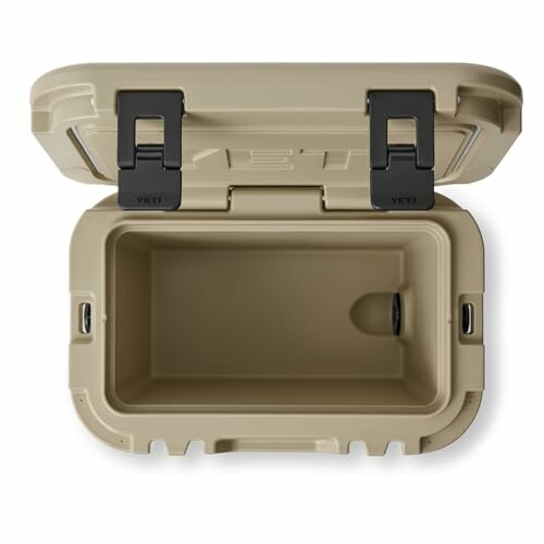 Open tan cooler box with black latches.